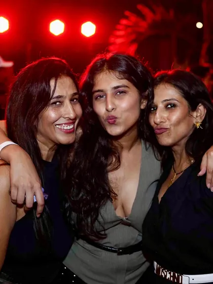 A group of friends making funny faces for the camera. It's all about having fun.