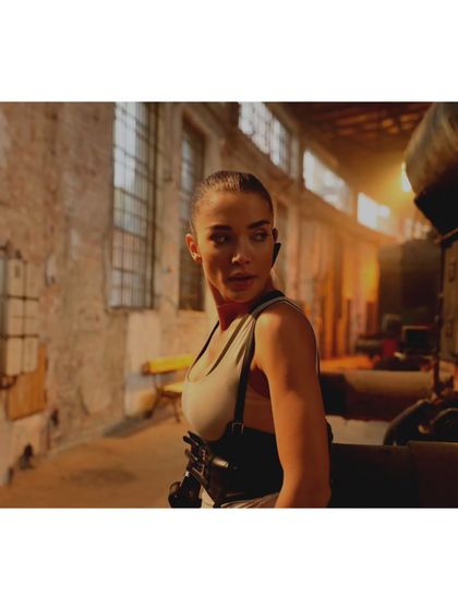 This shot from 'CRAKK' captures the atmospheric lighting on set. The costume was designed to work with the film's visual tone, ensuring the character looked right in every environment.