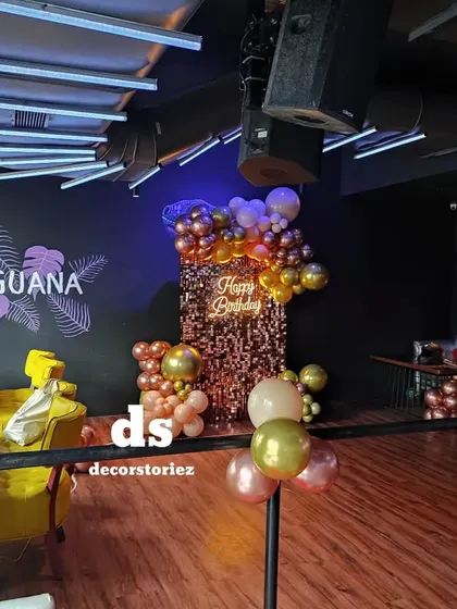 This photo shows our sequin wall backdrop set up for a birthday party at Club Iguana. The decor complements the club's ambiance and creates a dedicated, stylish spot for photos.