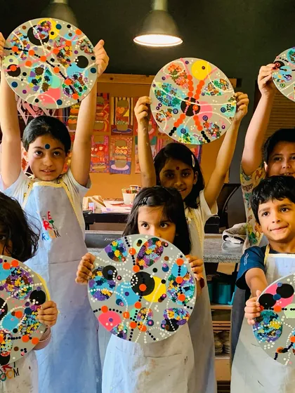 Another group of proud students with their finished abstract artworks.
