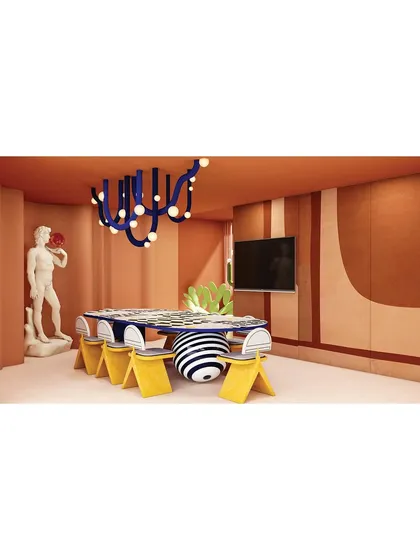 A wide shot of the dining area, showing how the combination of classic art, modern furniture, and bold colors creates a truly unique and memorable experience.