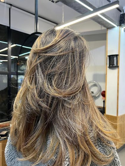 This is my specialty: dimensional, lived-in color that grows out seamlessly. This brunette balayage is a perfect example of low-maintenance beauty.