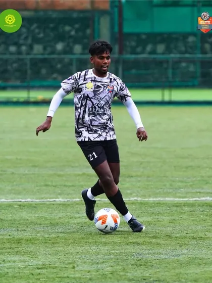 An athlete showcasing agility and speed, dribbling past opponents during a competitive fixture.
