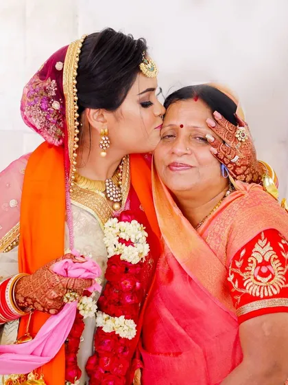 Some of the most powerful wedding photos are the unscripted ones. This is a beautiful, emotional moment between the bride and her mother. Capturing this gentle kiss is a core part of my family wedding portrait service, preserving the deep bonds and happy tears of the day.