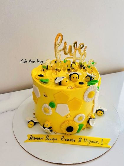 Bee sweet, bee kind, and enjoy a slice of this divine bee-themed cake.