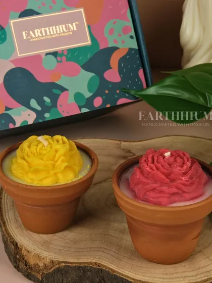 A yellow and red rose candle set in terracotta pots, perfect for adding a pop of color to your balcony or desk.