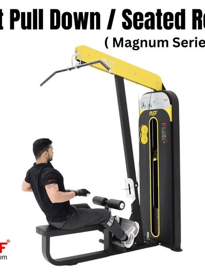A user performing a seated row on the Magnum Series machine.