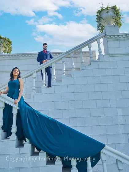 We use our wardrobe of long-trail gowns to add drama and elegance to shots on our grand white staircase, creating a truly cinematic feel.
