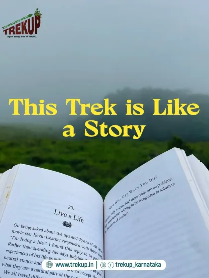 A creative shot comparing a trek to a story, with an open book against the misty green backdrop of the mountains.