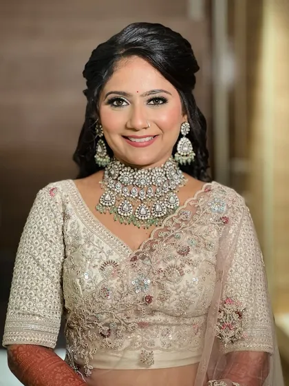 A happy, smiling portrait of the bride, looking fresh and beautiful for her reception.
