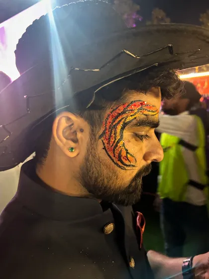 A cool red and black design that follows the curve of the eye. This client rocked it with his cowboy hat.