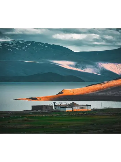 The last light of day catches a ridge overlooking the serene Tso Moriri lake in Ladakh. My landscape work focuses on capturing the dramatic interplay between light, land, and atmosphere in remote locations.