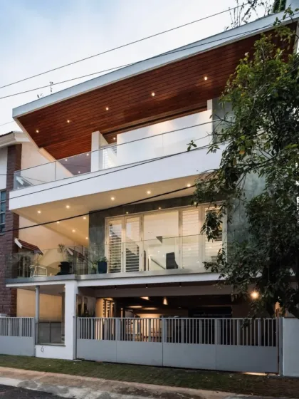 A poetic symphony of textures and transparency. Here, the warmth of a timber-clad ceiling meets the crisp precision of modern design, creating a facade that is both bold and elegant.