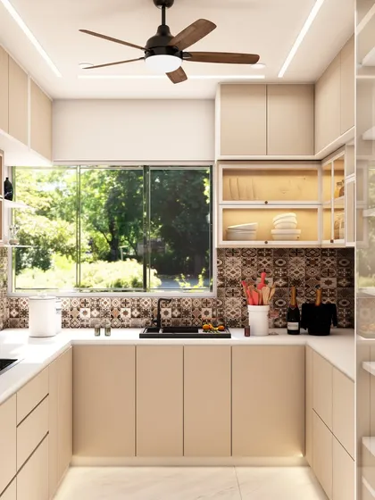 The full view of the U-shaped kitchen showcases the efficient work triangle and the abundance of natural light from the large window.