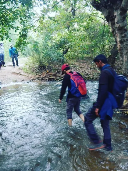 Another shot of our team practicing a safe river crossing, a crucial skill for any serious trekker.