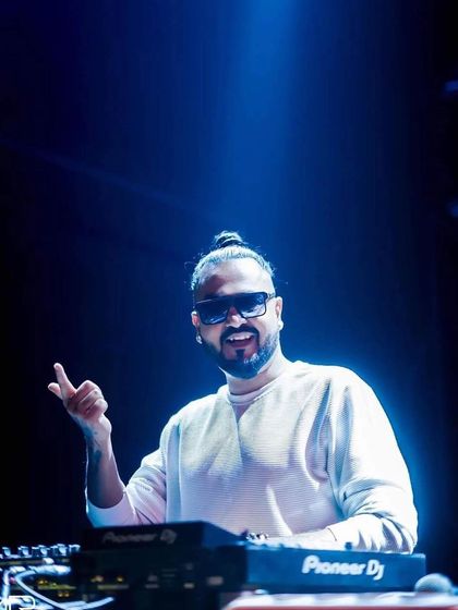 A smiling shot of me under the spotlight at Sunburn Union.