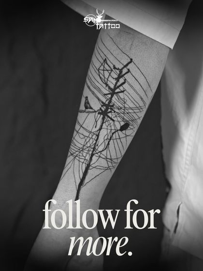 The finished abstract piece on Sammohit's arm. A unique tattoo representing connection, chaos, and freedom, brought to life with bold black lines.