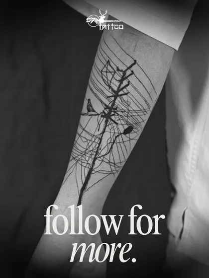 The finished abstract piece on Sammohit's arm. A unique tattoo representing connection, chaos, and freedom, brought to life with bold black lines.