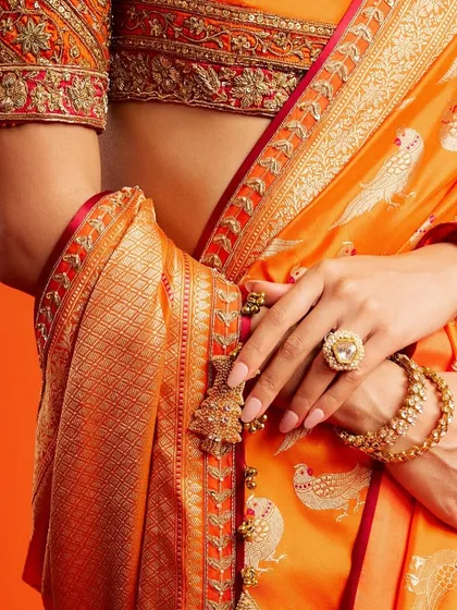 For a festive celebration, I designed these beautiful, sparkling nude nails for Ananya Panday. The subtle glitter and classic shape complemented her vibrant orange Benarasi brocade saree perfectly.