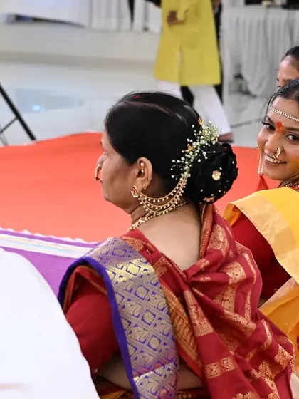 Looking back with a smile, this bride is enjoying her Punyawachan ceremony. The makeup is light and natural, perfect for daytime rituals.