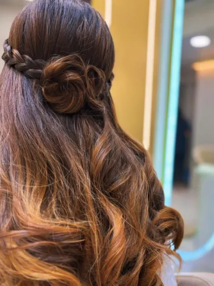 Another angle of the braided rose hairstyle, showing the beautiful craftsmanship and how it blends seamlessly with the curled ends.