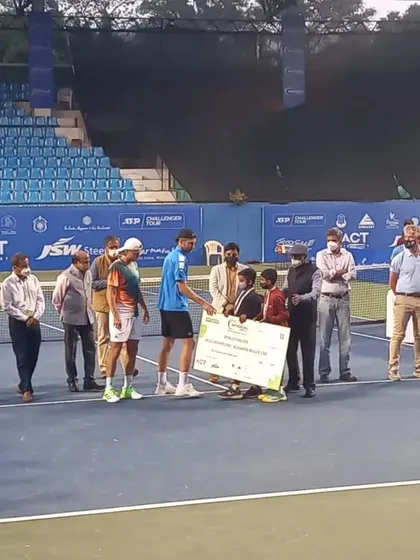 Our students presenting the winner's cheque at the Bengaluru Open 2022. We believe in involving our youth players in professional events to give them invaluable exposure to the world of competitive tennis.