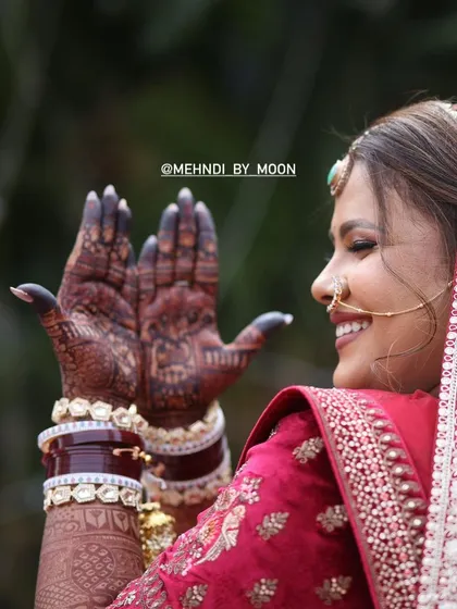 The joy on a bride's face when she sees her perfect mehndi stain. A dark stain is considered auspicious for a bride, and I make sure to provide the best quality henna for that perfect color.