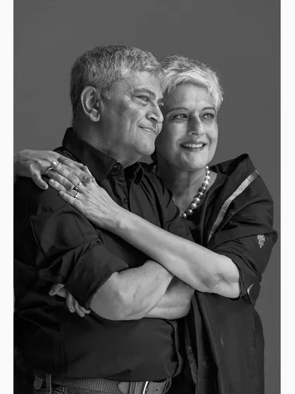 A serene and composed portrait of a couple, reflecting their deep bond and shared journey. This classic black and white style ensures the portrait remains timeless for generations.