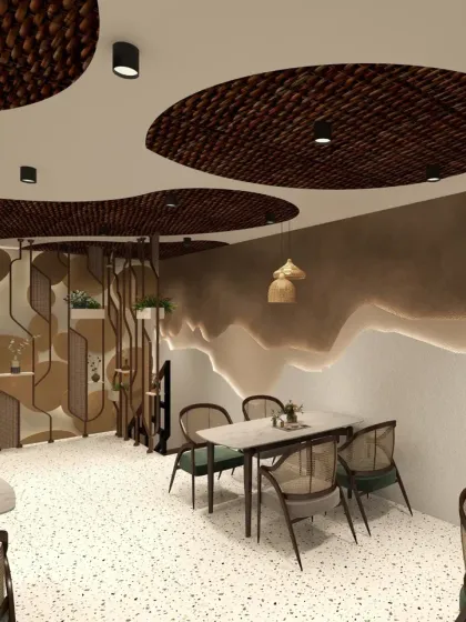 In this Haldwani cafe, I created a cozy, earthy atmosphere using natural materials and textures. The custom ceiling with woven cane inserts becomes a central design feature, complemented by terrazzo flooring and a layered wall texture to craft a unique and memorable cafe aesthetic.