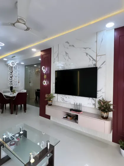 A wide-angle view showcasing the entire living and dining area, demonstrating how different functional zones can coexist harmoniously in an open-plan layout.
