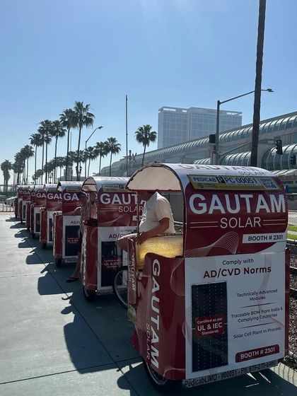 A fleet of our branded pedicabs lined up outside the Intersolar USA event in San Diego, highlighting our AD/CVD compliant modules for the US market.