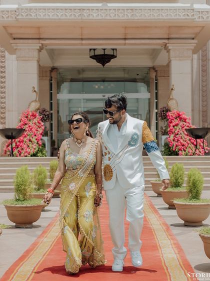 Harshit and his mother walking down the red carpet, a beautiful moment of family love and joy.