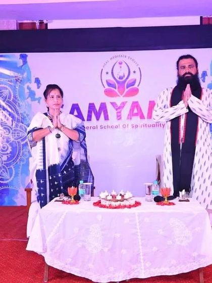 We are on stage during our Puri Yatra, a spiritual journey with our participants. This photo captures a moment of greeting and connection with the community during the retreat.