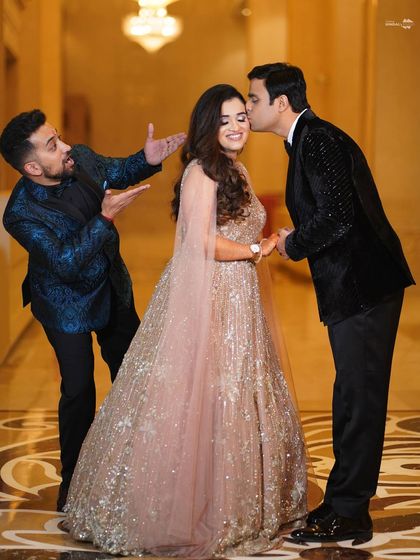 A fun, photobombed moment during the couple's engagement shoot. This candid picture shows the playful side of weddings and the joy of celebrating with friends.