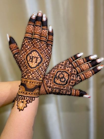 A beautiful design with personalized initials "LR" and "CL" in ornate frames, surrounded by intricate floral and geometric patterns.