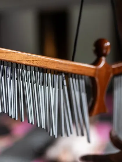 Wind chimes add another layer of soothing sound to our wellness experiences. Their gentle, random notes mimic the calming sounds of nature, enhancing the tranquil atmosphere.