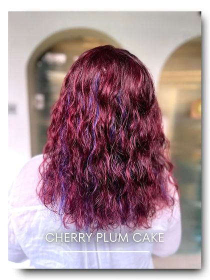 This vibrant 'Cherry Plum Cake' color is for the bold and adventurous. It combines deep red and purple tones for a unique, multi dimensional look that is full of personality.