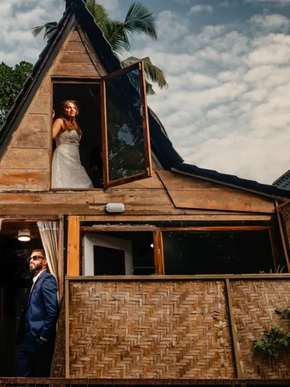 A creative portrait using the unique architecture of a wooden cabin in Goa. The split levels allow for a layered composition, telling a story of two individuals together in their own space.