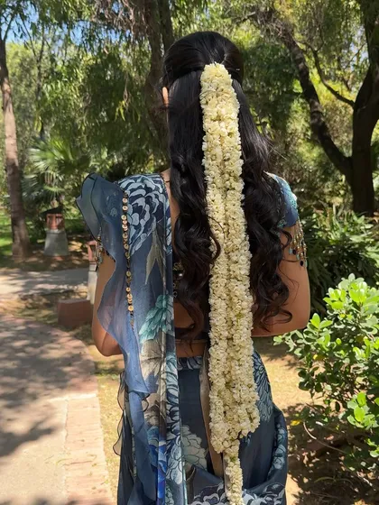 Another view of the stunning gajra hairstyle. It's a classic choice that always looks beautiful for traditional events.