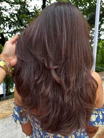 Sometimes all you need is a color refresh and a good haircut. I touched up her roots, toned her existing highlights, and gave her a fresh layered cut to bring her hair back to life.