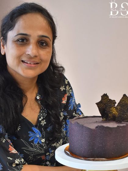 This student's ganache cake is a great example of mastering a smooth finish and adding artistic flair with decorations.