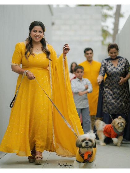 The bride makes a joyful entrance with her beloved pets. I love capturing these personal touches that make your wedding story uniquely yours.