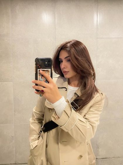 A mirror selfie that gives another look at my hair transformation. This type of casual shot helps reinforce the final result in a different, relatable setting.