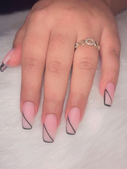 A minimalist design with a matte pink base and a single, clean black line on square-shaped nails.