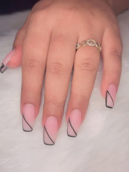 A minimalist design with a matte pink base and a single, clean black line on square-shaped nails.