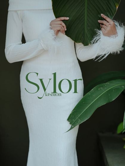 This editorial-style image with a "Sylor Fashion" overlay is perfect for a brand lookbook, showcasing the texture and fit of the dress.