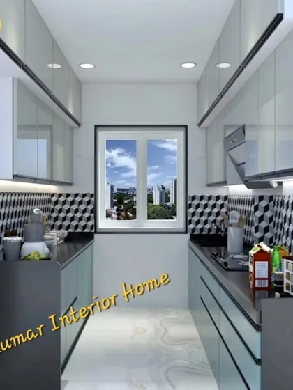 A parallel kitchen with a window at the end, providing natural light. The geometric backsplash and dual-color scheme create a modern and dynamic look.