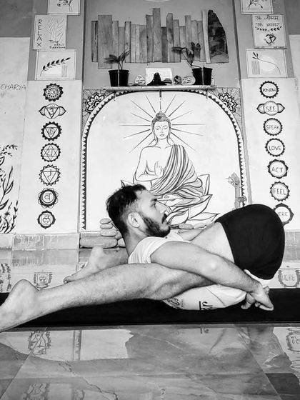 An intricate leg-behind-head posture, Yoganidrasana, that promotes deep relaxation and flexibility.