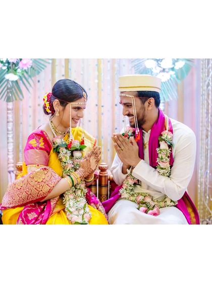 A sweet moment of interaction between the bride and groom during their ceremony, showcasing their 15-year love story.