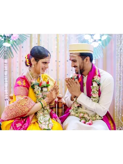 A sweet moment of interaction between the bride and groom during their ceremony, showcasing their 15-year love story.